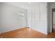Bright bedroom with hardwood floors, built-in storage and a window letting in plenty of natural light at 1025 E 60Th St, Indianapolis, IN 46220