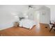 Cozy bedroom with hardwood floors, a ceiling fan, and an arched doorway at 1025 E 60Th St, Indianapolis, IN 46220