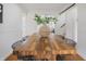 Charming dining room with a rustic wooden table, stylish chairs, and bright lighting creating a warm ambiance at 1025 E 60Th St, Indianapolis, IN 46220