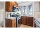 Well-equipped kitchen with stainless steel appliances, ample counter space, and natural light, ideal for cooking enthusiasts at 1025 E 60Th St, Indianapolis, IN 46220