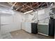 Basement laundry room featuring a washer, dryer, sink and shelving at 1025 E 60Th St, Indianapolis, IN 46220