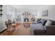 Sunlit living room featuring a cozy fireplace, hardwood floors, and stylish furnishings for comfortable living at 1025 E 60Th St, Indianapolis, IN 46220