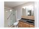 Bathroom featuring walk-in shower, decorative tile accents, and modern vanity at 1044 Timber Creek Dr # 4, Carmel, IN 46032