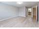Spacious bedroom featuring light hardwood flooring and a bright window at 1044 Timber Creek Dr # 4, Carmel, IN 46032