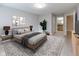 Well-decorated bedroom featuring neutral walls, patterned rug, and stylish decor at 1044 Timber Creek Dr # 4, Carmel, IN 46032