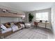 Bedroom featuring bunk bed, desk area, and natural light from the bright window at 1044 Timber Creek Dr # 4, Carmel, IN 46032