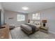 Bright bedroom featuring neutral walls, patterned rug, and stylish decor at 1044 Timber Creek Dr # 4, Carmel, IN 46032