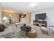Open-concept living room showing modern furnishings and a view of the kitchen at 1044 Timber Creek Dr # 4, Carmel, IN 46032