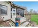 Cozy screened-in back porch with outdoor grill and wooden railing for comfortable outdoor living at 10934 Haig Point Dr, Fishers, IN 46037