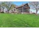 Spacious backyard featuring a screened-in porch, ideal for relaxing and enjoying the outdoors at 10934 Haig Point Dr, Fishers, IN 46037