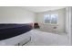 Bright bedroom features a large window, neutral carpet, and space for personalization at 10934 Haig Point Dr, Fishers, IN 46037