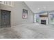 Bright living room featuring a fireplace, high ceilings, and neutral carpet at 10934 Haig Point Dr, Fishers, IN 46037