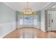 Living room with a large bay window bringing in natural light, featuring hardwood floors at 10934 Haig Point Dr, Fishers, IN 46037