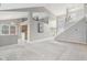 Open-concept living room with high ceilings, carpet flooring, and staircase at 10934 Haig Point Dr, Fishers, IN 46037
