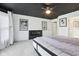 Main bedroom with a modern fireplace, plush carpets, and neutral color palette at 10934 Haig Point Dr, Fishers, IN 46037