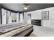 Main bedroom showcasing a modern fireplace, plush carpeting, and natural light at 10934 Haig Point Dr, Fishers, IN 46037