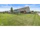 Large fenced backyard featuring a playset and covered patio, perfect for outdoor enjoyment at 11003 Liberation Trce, Noblesville, IN 46060
