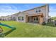 Well-maintained backyard featuring a covered patio, playset, and manicured lawn, ideal for relaxation and play at 11003 Liberation Trce, Noblesville, IN 46060