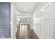 Inviting foyer with hardwood floors and wainscoting, leading to the staircase and open living area at 11003 Liberation Trce, Noblesville, IN 46060