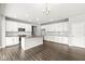 Modern kitchen with stainless steel appliances, island, and ample cabinet space, perfect for cooking at 11003 Liberation Trce, Noblesville, IN 46060