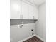 A utility room featuring white cabinets with washer and dryer hookups at 11003 Liberation Trce, Noblesville, IN 46060