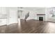 Living room with fireplace, built-ins, and staircase at 11003 Liberation Trce, Noblesville, IN 46060