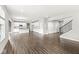 Spacious open-concept living area with a kitchen, dining area, and staircase at 11003 Liberation Trce, Noblesville, IN 46060