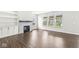 Bright living room with a fireplace, built-in shelves, and large windows, perfect for relaxation at 11003 Liberation Trce, Noblesville, IN 46060