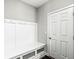 Mudroom featuring coat hooks, a bench, and storage space at 11003 Liberation Trce, Noblesville, IN 46060