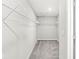 Spacious walk-in closet featuring wire shelving and neutral decor, offering ample storage space at 11003 Liberation Trce, Noblesville, IN 46060