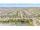 Panoramic aerial view of a residential area featuring homes, ponds, and tree-lined streets at 11182 Black Gold Dr, Noblesville, IN 46060
