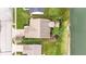 Aerial view of a well-maintained home with lush landscaping and manicured lawn near a serene pond at 11182 Black Gold Dr, Noblesville, IN 46060