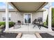 This covered back porch features furniture, a grill, and ample space for entertainment at 11182 Black Gold Dr, Noblesville, IN 46060