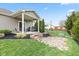 Backyard with covered porch, seating, and yard, perfect for outdoor activities at 11182 Black Gold Dr, Noblesville, IN 46060