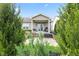 This backyard features a covered porch and outdoor patio with space for entertaining at 11182 Black Gold Dr, Noblesville, IN 46060