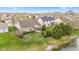 Aerial view of backyard with green lawn, landscaping and a view of the serene pond at 11182 Black Gold Dr, Noblesville, IN 46060