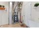 Utility area in the basement with a new water heater, a furnace, and storage space at 11182 Black Gold Dr, Noblesville, IN 46060