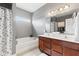 Bathroom featuring a double sink vanity, soaking tub, and neutral gray walls at 11182 Black Gold Dr, Noblesville, IN 46060