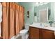 Bathroom featuring a single sink vanity, toilet, and shower with a patterned curtain at 11182 Black Gold Dr, Noblesville, IN 46060