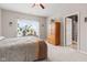 Bedroom featuring large window, bed and side table with decorative plants for a touch of nature at 11182 Black Gold Dr, Noblesville, IN 46060