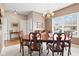 Dining area featuring classic wood furniture set and large windows that fill the space with natural light at 11182 Black Gold Dr, Noblesville, IN 46060
