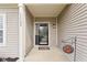 View of the covered front porch, featuring the home's address and a decorative sun ornament at 11182 Black Gold Dr, Noblesville, IN 46060