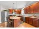 Kitchen featuring stainless appliances, an island with bar stool seating, and natural lighting at 11182 Black Gold Dr, Noblesville, IN 46060