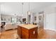 Open kitchen view with island and pendant lighting, connecting to the living area for easy entertaining at 11182 Black Gold Dr, Noblesville, IN 46060