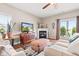 Inviting living room features a fireplace, a TV, and comfortable seating with lots of natural light at 11182 Black Gold Dr, Noblesville, IN 46060