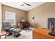 Home office features a leather recliner, wooden desk with computer, and neutral wall color at 11182 Black Gold Dr, Noblesville, IN 46060