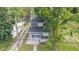 An aerial perspective of a charming two-story home with a well-maintained lawn and mature trees at 1139 E 35Th St, Indianapolis, IN 46205