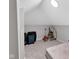 Bright attic room with skylight, neutral carpet, perfect for storage or a playroom at 1139 E 35Th St, Indianapolis, IN 46205