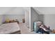Neutral attic room with sloped ceilings, carpeted floor, and plenty of space at 1139 E 35Th St, Indianapolis, IN 46205