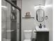 Modern bathroom features a glass-enclosed shower, toilet, and vanity at 1139 E 35Th St, Indianapolis, IN 46205